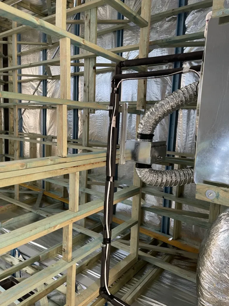 Building under construction with insulation and ducts