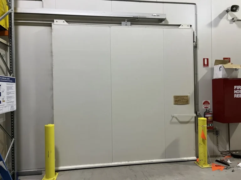 Large white sliding door in storage area.