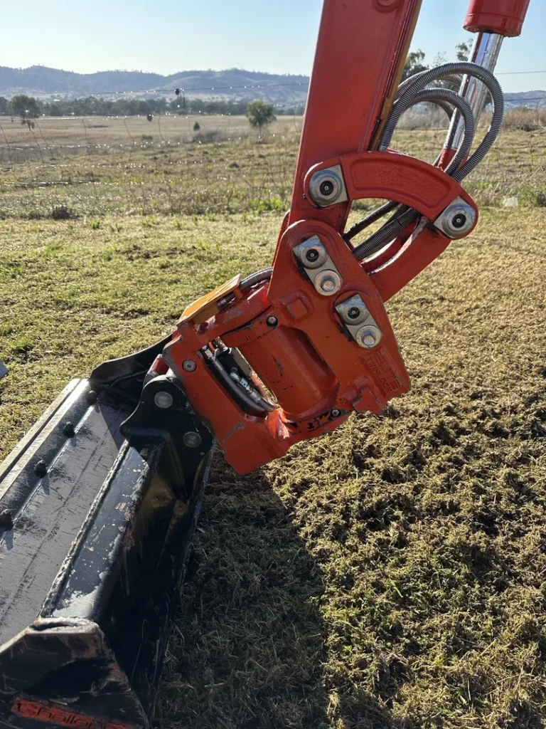 Close-up of an excavator arm.