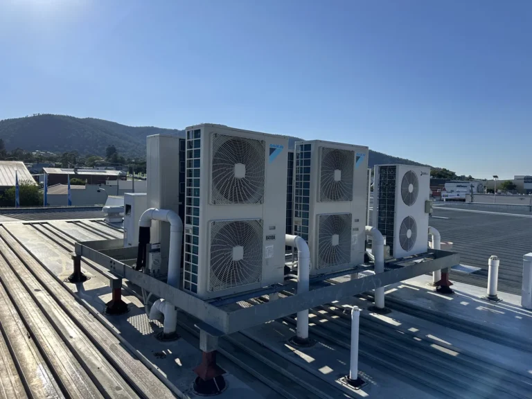 Rooftop HVAC units with scenic background